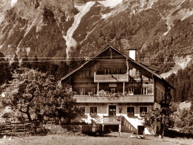 Black and white postcard with the original fence
