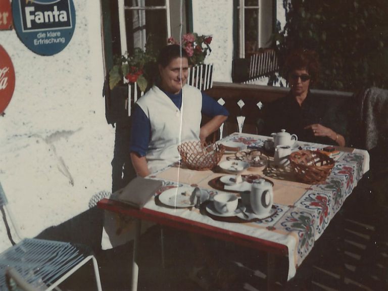 Grandma Hedegger with a guest during breakfast