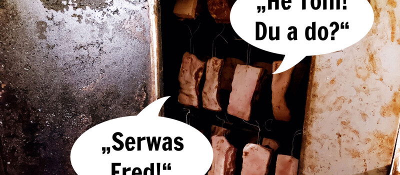 Speck hängt in der Selche